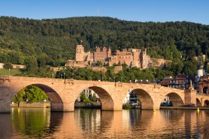 A historic bridge in Heidelberg, right under a castle. Heidelberg is located in the black forest region, just like the hotel SCHWARZWALD PANORAMA