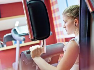 A woman working out at the gym of the wellness hotel SCHWARZWALD PANORAMA